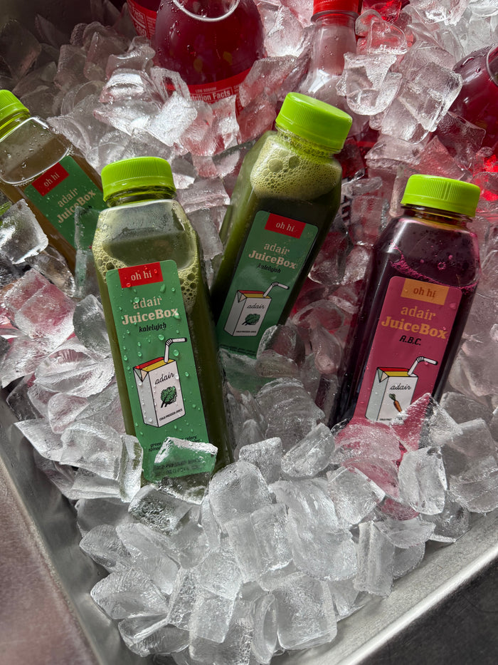 Cold pressed juice cases from Adair Pantry Houston